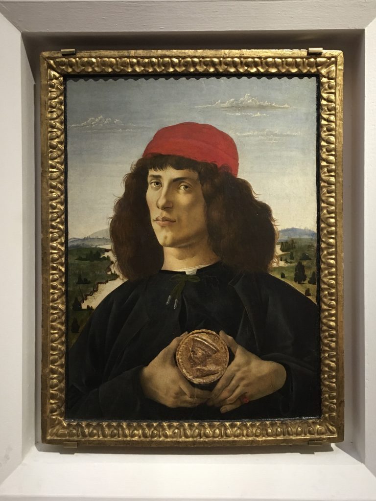 Portrait of a Young Man Holding a Medallion | Nicholas Hall